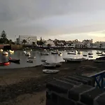 Casa pescado, madera y sol